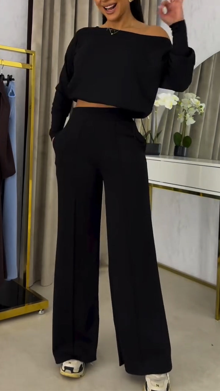 Női kosztüm laza, váll nélküli blúzzal és lezser nadrággal