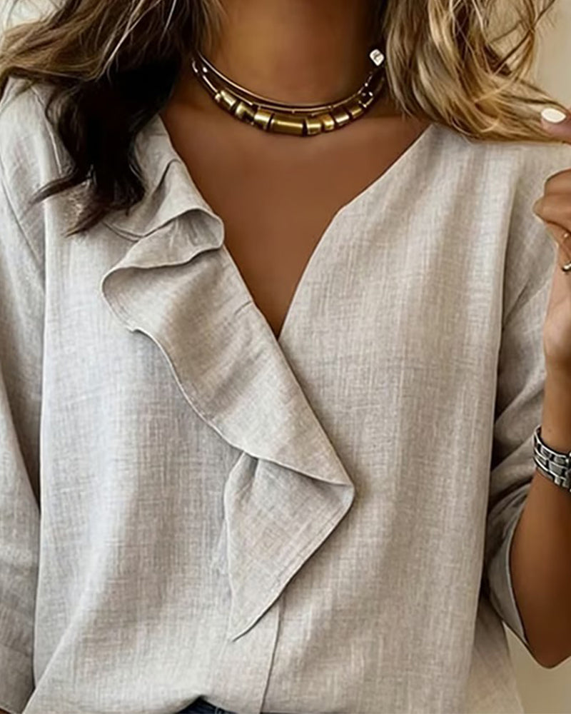 Egyszínű hosszú ujjú blúz fodros díszítéssel