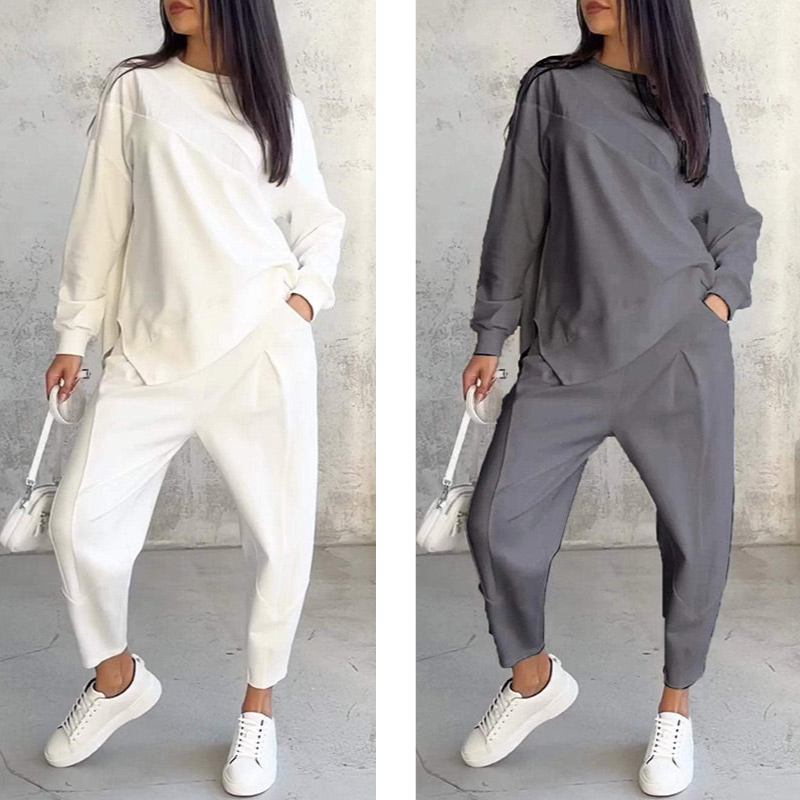 Női szett, amely egy hosszú ujjú blúzból és egy szabálytalan szegélyű nadrágból áll.